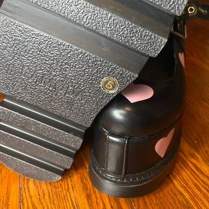Black Lamoda platform Mary Janes with baby pink hearts.
